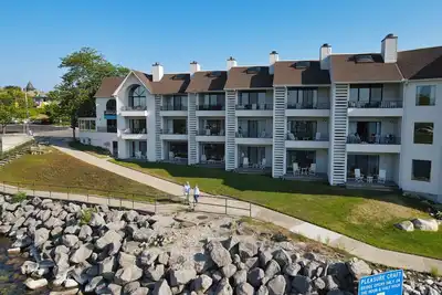 Image de Lake Charlevoix Views with Walkout Patio | Pool, Hot Tub, Sauna