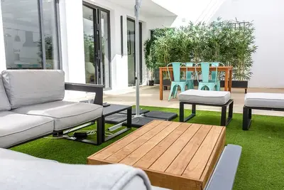 Ground floor with private patio next to the beach