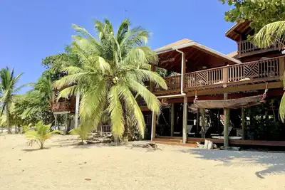 Beachfront home with pristine, calm waters, white sands and unbelievable sunset