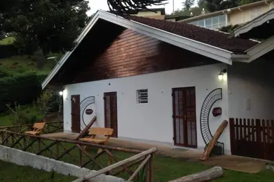 Image de Campos do Jordão - Suite with living room, on the mountain overlooking the woods
