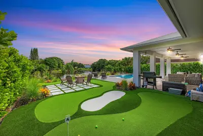 Image de New Construction Lakefront Home with  Mini Golf Course, Heated Saltwater Pool!