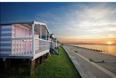 Image de Breakwater house stone throw from the beach with an outside pool.