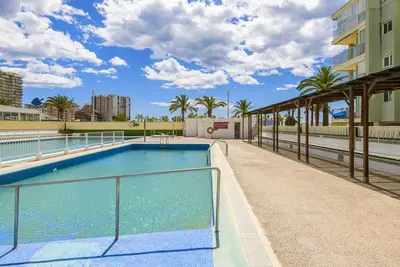 Image de Confortable appartement avec piscine, climatisation, Wifi, Tv, balcon, animaux admis et parking