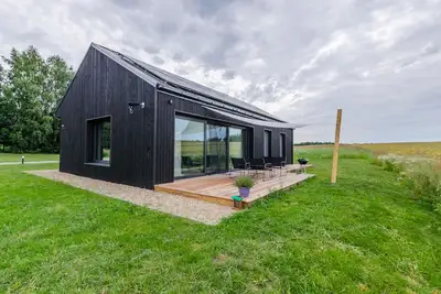 Two country houses with access to their own beach, close to the forest and field