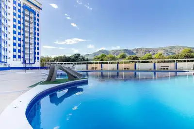Image de Joli appartement avec piscine, climatisation, Wifi, Tv, terrasse, animaux admis et parking