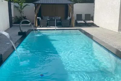 Image de A Private pool villa with a golf course view