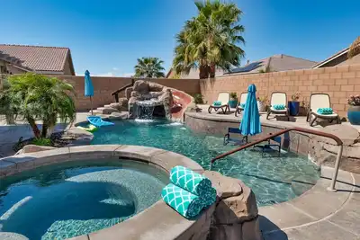 Image de Backyard Bliss - Home with Your Own Private Pool, Slide, Waterfall!