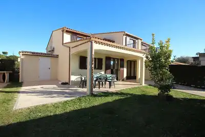 Image de Spacieuse Maison d'angle dans domaine des Tamaris 5 pièces 6 á 7 couchages Wifi, piscines. . .