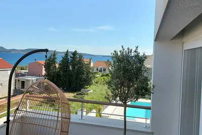 Image de Designer Penthouse apartment, with large 50m2 heated pool, 30s walk to the beach