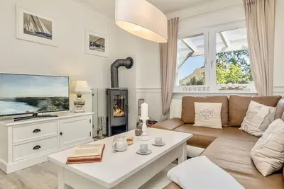 Image de Cozy vacation apartment on the Baltic Sea in the green, with fireplace and sauna.