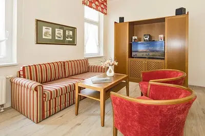 Image de Vacation apartment on the Baltic Sea with conservatory - use of sauna in the house included!