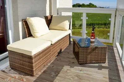 Image de Vacation apartment near the beach with sauna and great, covered balcony with dyke view