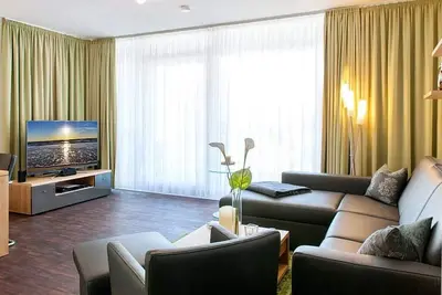 Image de High-quality family apartment with large balcony, whirlpool bath and wood-burning stove - DünenResort Binz