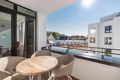 Image de Sunny, modern vacation apartment with loggia and underfloor heating near the beach