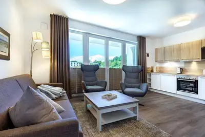 Image de Great vacation apartment close to the beach with terrace, playground and sauna area -