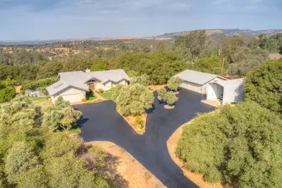Image de Spacious residential  home with pool, bar, and game room.