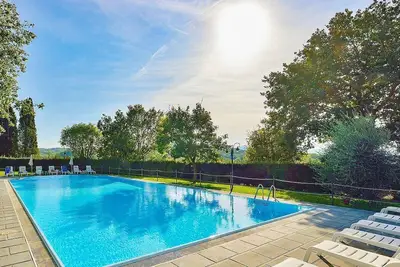 Image de Casa Caprifoglio G: A characteristic and welcoming two-story apartment that is part of a villa surrounded by the greenery, with Free Wi-Fi.