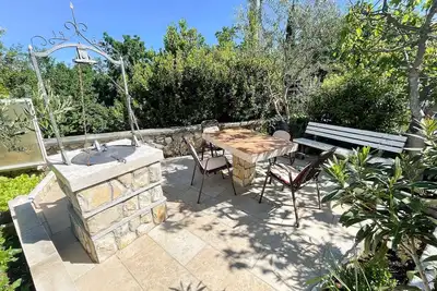 Image de Appartement de vacances avec terrasse, WiFi et climatisation