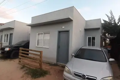 Image de Beach house in front of green area