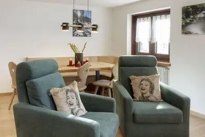 Friendly Apartment walking distance village center and ski bus gondola.