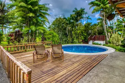 Image de Large Home Set Into Lush Landscape with Private Pool & Gorgeous Deck Area