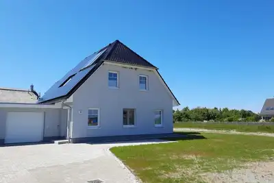 Image de New, exclusive vacation home close to the beach with sauna, 3 bedrooms, fireplace, Wlan, garage