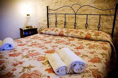 Image de The Panoramic: 1800s trullo house with vineyard and Itria Valley views