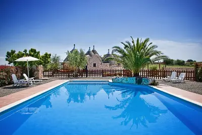 Image de Trulli il Castagno, trulli farmhouse with pool, garden and private tavern