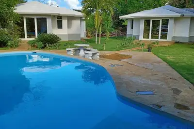 Private villa with pool and bar.