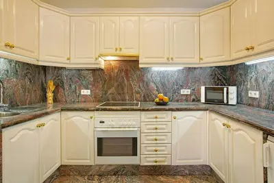 Image de Appartement 'Pomelo' avec vue sur les montagnes, Wi-Fi et piscine partagée