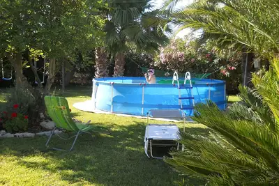 Image de Villetta dei Cocus Ă quelques minutes de la mer avec jardin et piscine hors sol