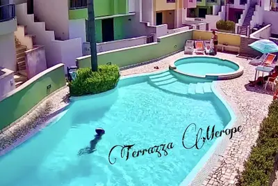 Merope terrace in residence with pool