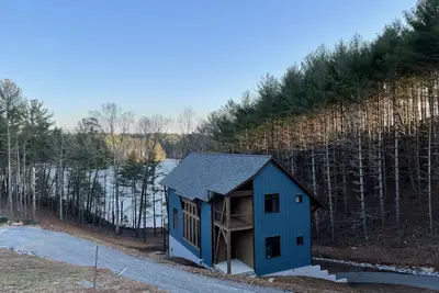 Image de Lake front home with dock in a small cove with a beach.