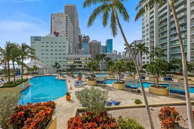 Image de Resort style with pool and water views