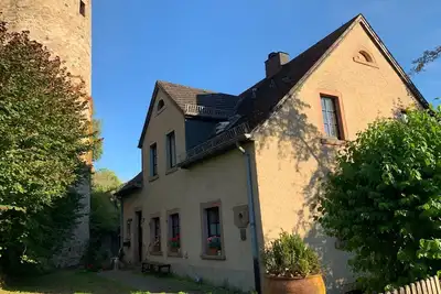 Image de Idyllic mill building directly on the city wall with a large garden