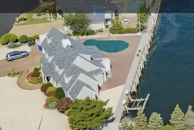 Image de Luxury Waterfront 6 Bed 4 bath w Heated Pool, Booking For Summer 2025 Now! ! !