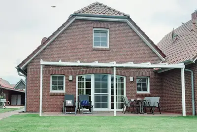 Image de Friesenperle - Great vacation home (85sqm) for 4 people with fireplace directly on the