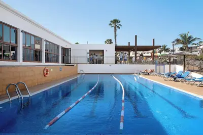 Image de Appartement \"Playa Flamingo 34\", proche plage, avec vue mer, piscine, Wi-Fi et terrasse.