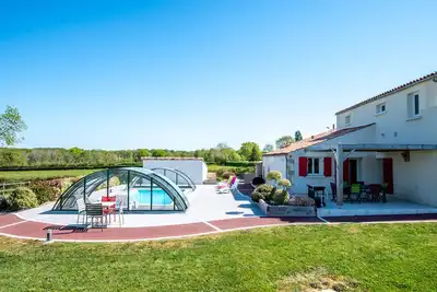Image de Gîte for 12 people, classified 4 **** with heated and covered swimming pool