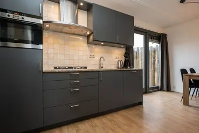 Image de Jolie maison avec lave-vaisselle dans un parc de vacances, situé sur Texel