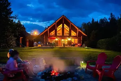 Image de Le Jadanie Chalet - Chalet bois rond, plage privée avec spa