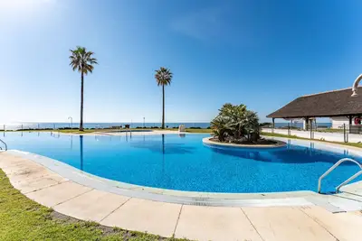 Image de Appartement \"Mi Capricho Beachfront Apt\", avec Wi-Fi & piscine partagée