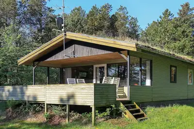 Image de Maison de vacances pour 6 a Blokhus-By Traum