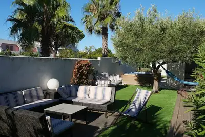 Image de Gd Marina 9 Pers+ Gd Jardin + Appontement Bateau + 5mn Plage