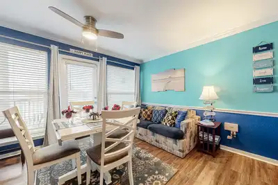 Beachfront condo with heated pool, balcony views, hot tub & W/D