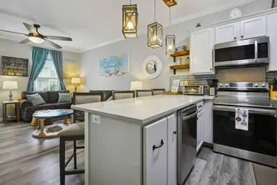 Image de “Sunseeker” Luxurious townhome Steps to the pool & beach! Ping pong!