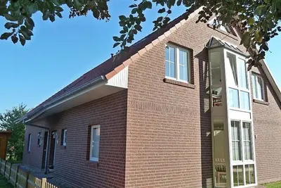 Image de Ant Watertoorn - Kinderfreundliche Ferienwohnung in Norden