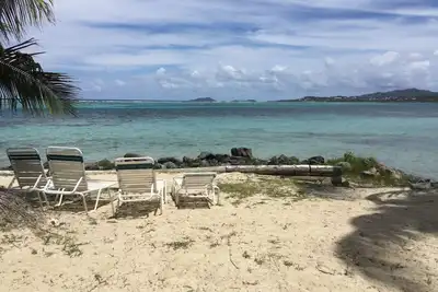 A Tropical Paradise Inside and Out, right on the Beach! ! !
