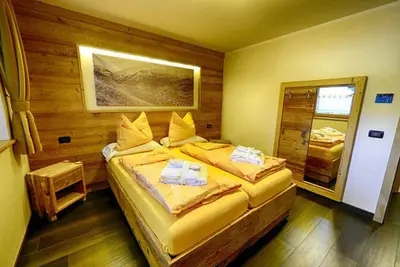 Image de Appartement Salient - Baita Cusini avec vue sur les montagnes, espace spa et Wi-Fi.