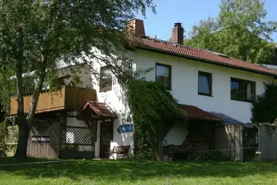 Image de RHÖN-Antik\" apartment with wood-burning stove and terrace for barbecuing.